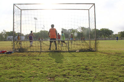 People on grassy field
