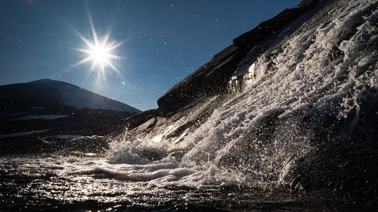 WATER SPLASHING ON SUNNY DAY