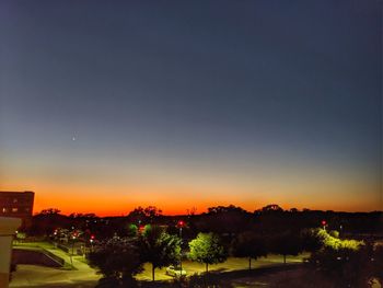 Scenic view of landscape against sky at sunset