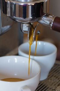 Preparing two espressos in a professional coffee machine