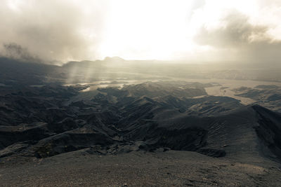 Aerial view of dramatic landscape against sky