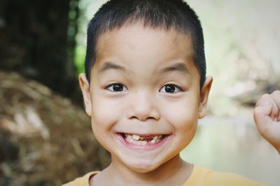 Close-up portrait of smiling boy