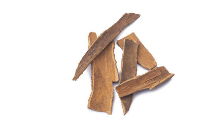 Close-up of wooden box against white background