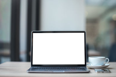 Close-up of laptop on table
