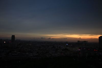 Cityscape against sky at dusk