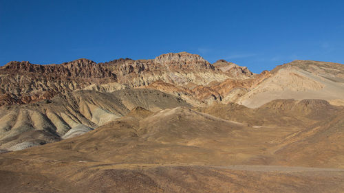 View of desert against mountain range