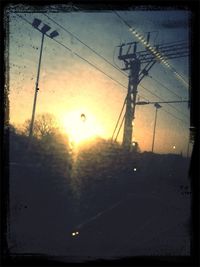 Electricity pylon at sunset