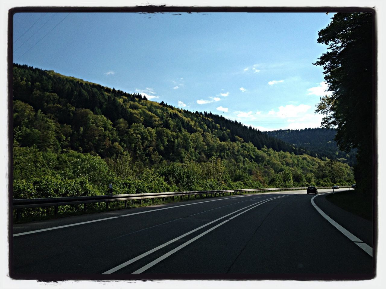 road, mountain, transfer print, transportation, sky, tree, road marking, the way forward, auto post production filter, country road, scenics, tranquility, tranquil scene, landscape, nature, cloud, mountain range, beauty in nature, diminishing perspective, day