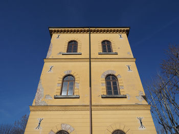 Low angle view of building against blue sky