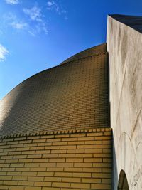 Low angle view of building against blue sky