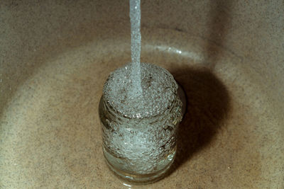 High angle view of drinking glass on table