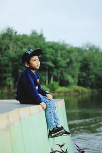 Boy looking away in lake