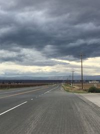 Road against storm clouds