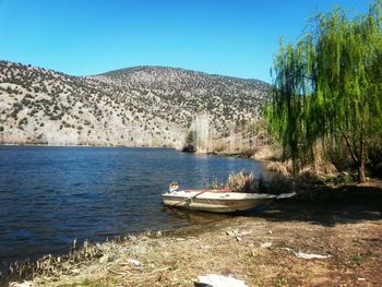 Boats moored in lake