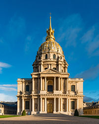 Low angle view of building against blue sky