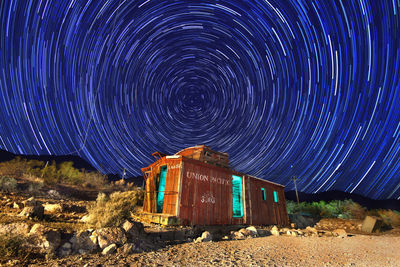 Panoramic shot of abandoned building against sky at night