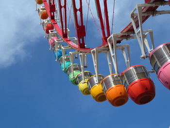 Low angle view of ferris wheel against sky