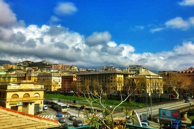 Buildings against cloudy sky