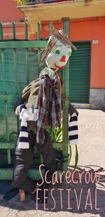 Rear view of man with graffiti on wall