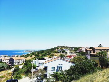 High angle view of townscape against clear blue sky