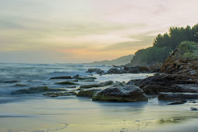 Scenic view of sea against sky during sunset