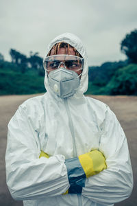 Scientist wearing protective workwear standing outdoors