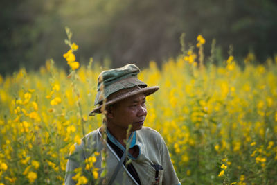 Close-up of woman holding plant