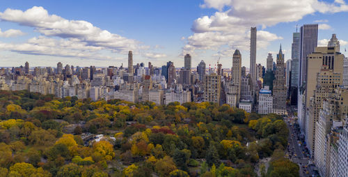 Panoramic view of buildings in city against sky