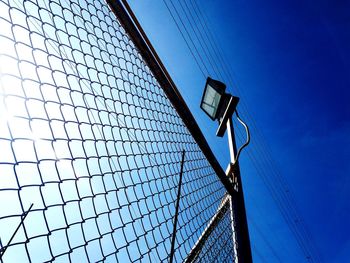 Low angle view of modern building against blue sky