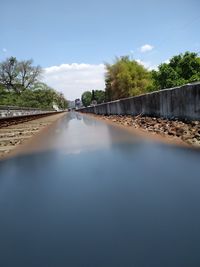 River amidst trees against sky