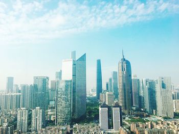 Skyscrapers in city against sky