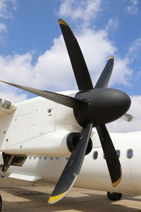 Low angle view of airplane propeller against sky