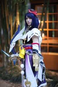 Portrait of young woman wearing traditional clothing standing outdoors