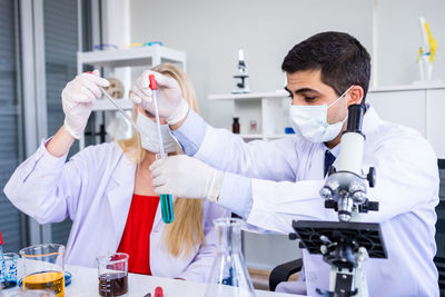 Scientist wearing man working in laboratory