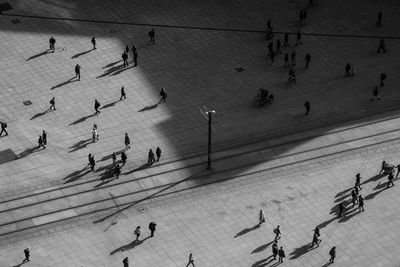 High angle view of people walking on footpath at alexanderplatz