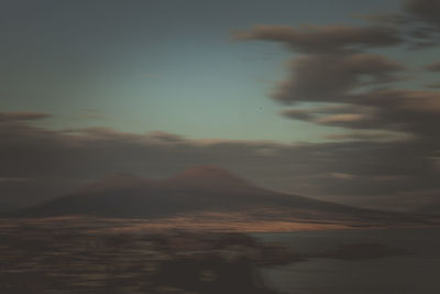 Scenic view of landscape against sky at sunset