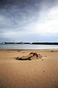 Surface level of beach against sky