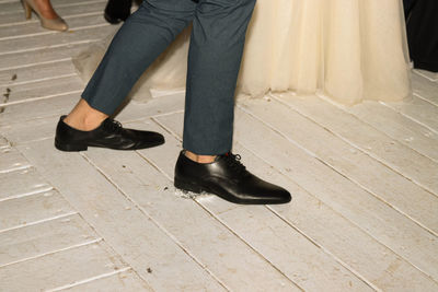 Low section of people standing on footpath