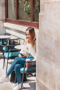 Woman sitting on chair