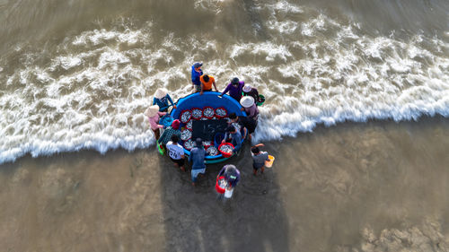 High angle view of man swimming in sea