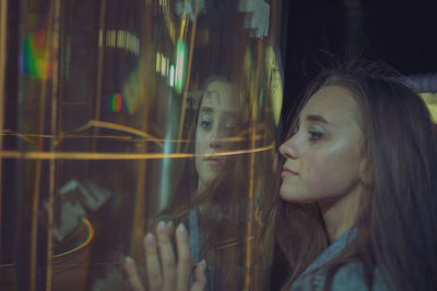 Woman by light painting at night