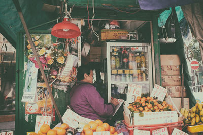 Man for sale at market stall