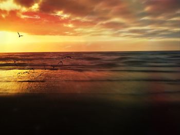 Dramatic sky over sea during sunset