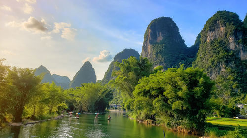 A small river against backdrop of the yellow mountains in china. tourist district