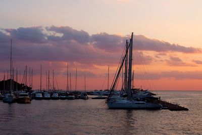 Sailboat in sea at sunset