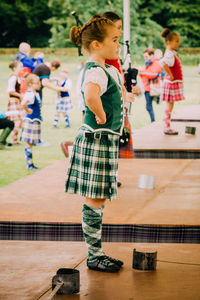 Boy playing with arms raised