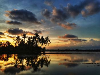 Scenic view of lake against sky during sunset