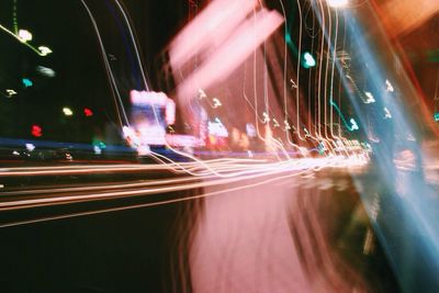 Light trails on road in city at night