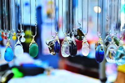 Close-up of decorations hanging in store for sale