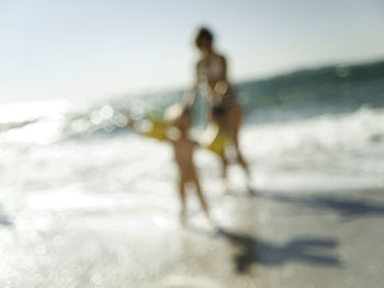 Blurred motion of man on beach